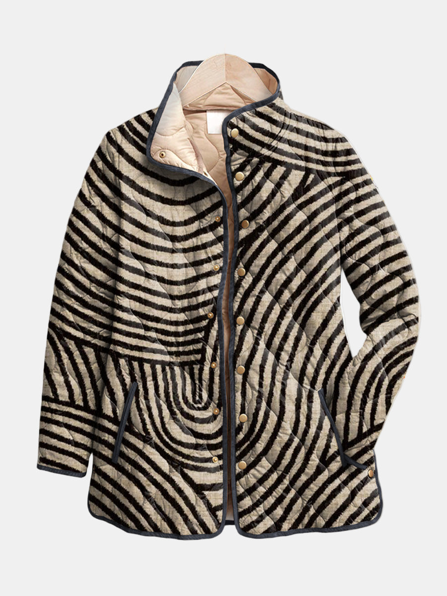 Inaya Bennett and Lowe women's quilted jacket with retro circle-print design, featuring a stylish, padded outerwear look.