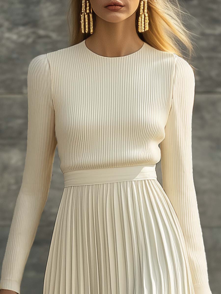 Charlotte ribbed knit pleated midi dress for women by Bennett and Lowe, featuring a fitted bodice and flowing pleated skirt.