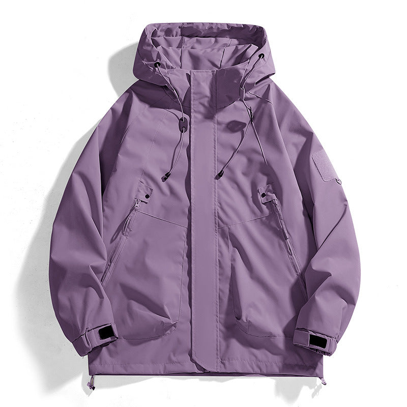 Women's waterproof outdoor jacket with adjustable hood and breathable inserts