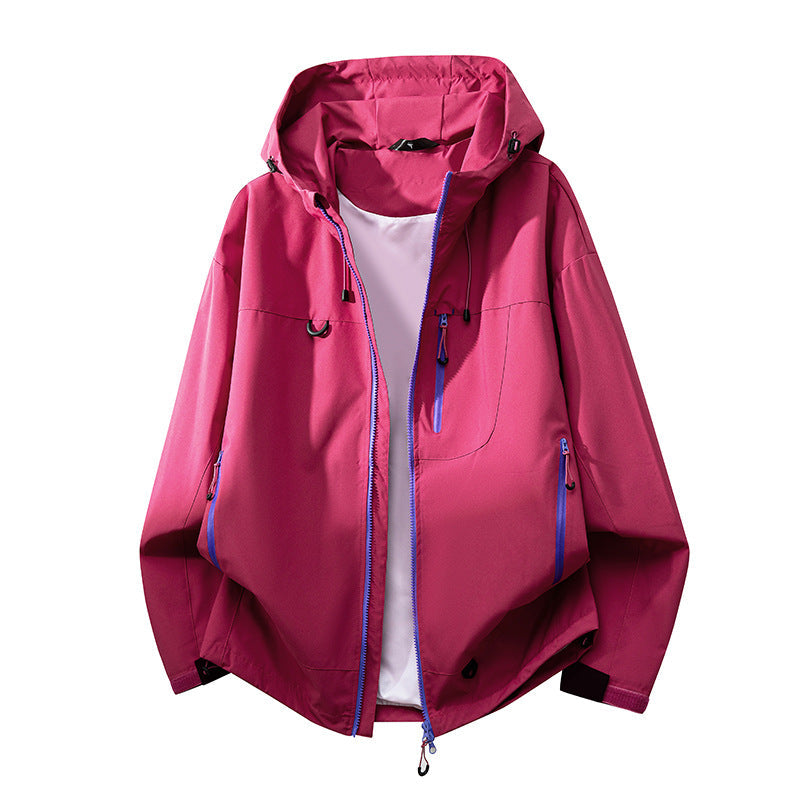 Technical outdoor jacket for women with multifunctional pockets and adjustable hood system