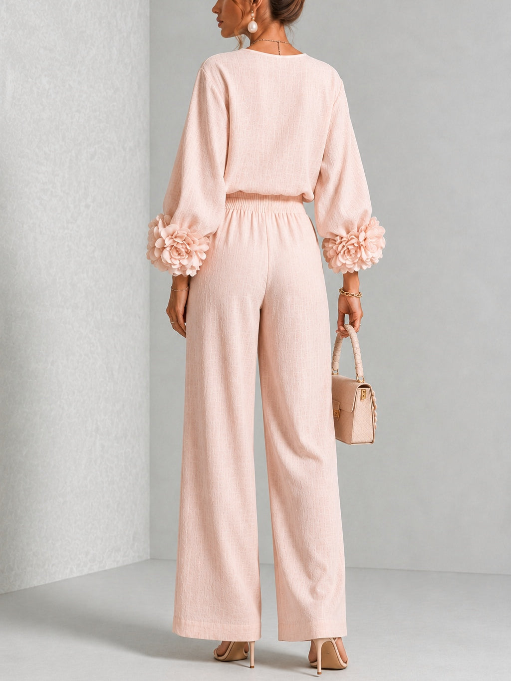 Pink Yolanda two-piece set for women by Bennett and Lowe, featuring ruffle cuff details on the top and matching pants.