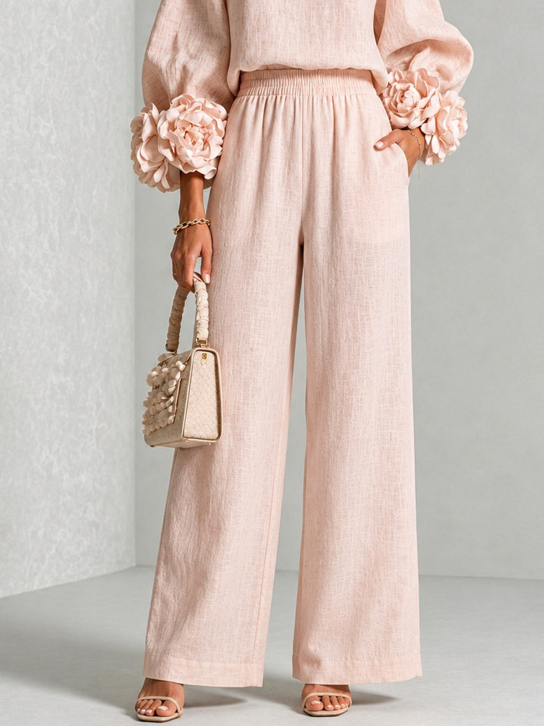 Pink floral-cuff top and wide-leg pants two-piece set for women by Bennett and Lowe, shown on a model.