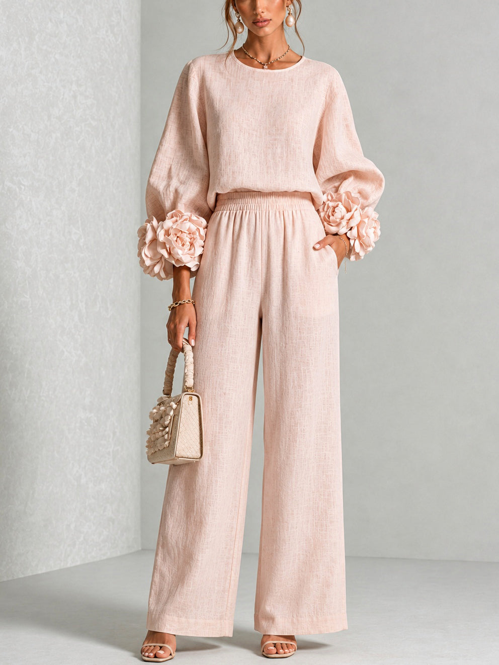 Pink floral-cuffed top and wide-leg pants two-piece set for women by Bennett and Lowe, styled on a model.