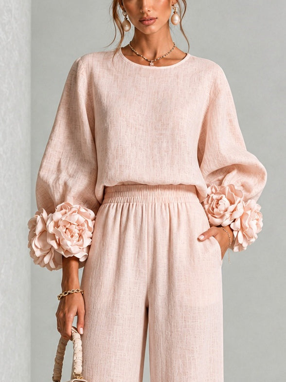 Pink floral-cuff top and wide-leg pants two-piece set for women by Bennett and Lowe, displayed on a model.